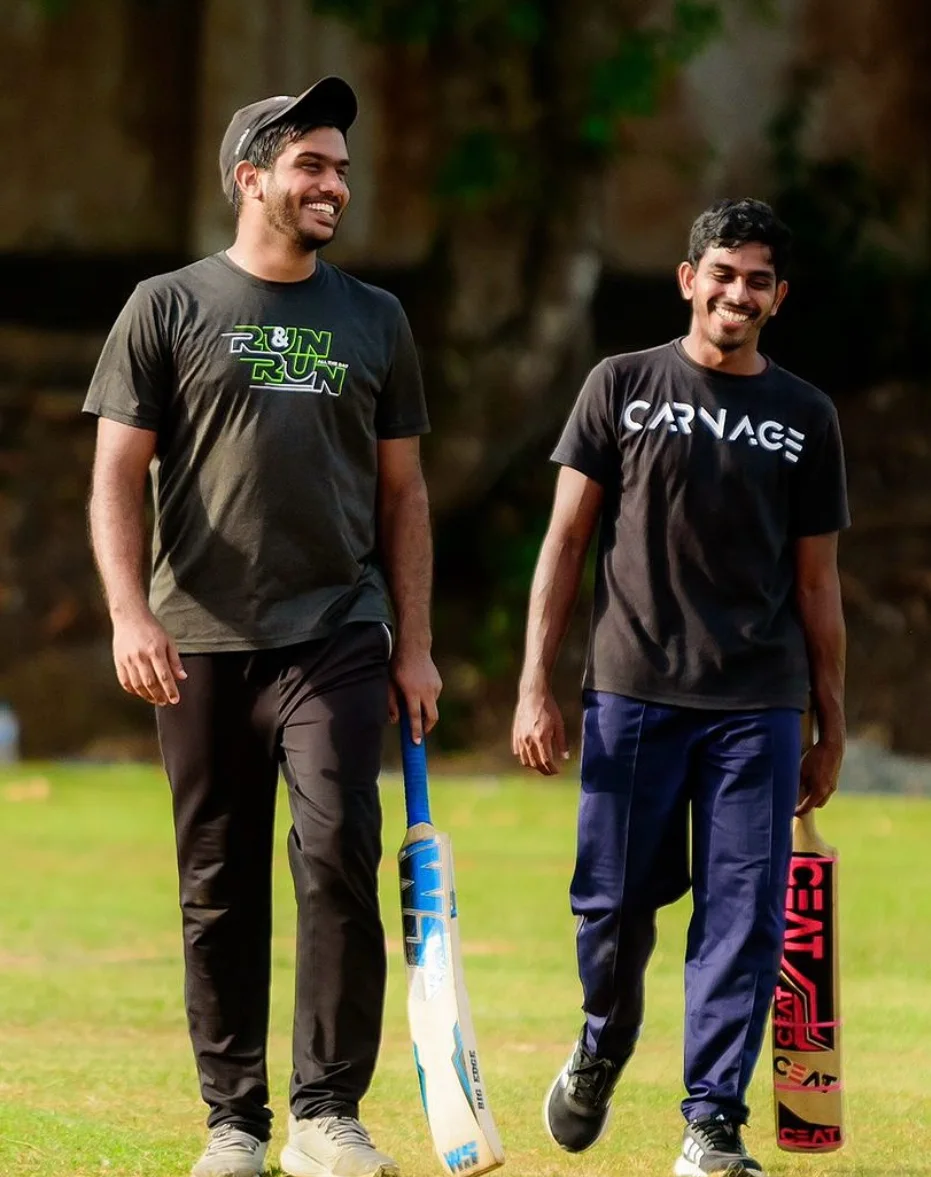 Oshan Mendis with cricket bats